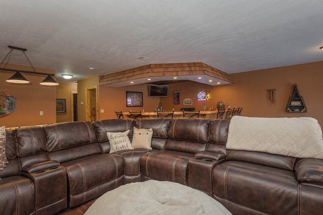 living room featuring a textured ceiling