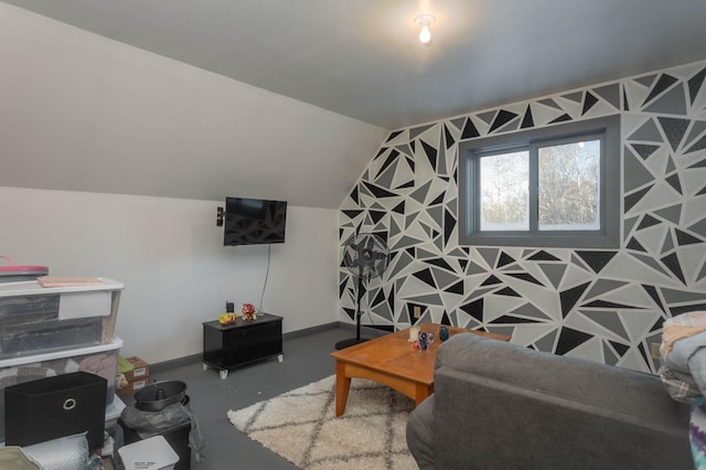 living room with vaulted ceiling and concrete flooring