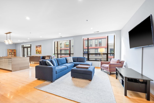 living room with light hardwood / wood-style flooring