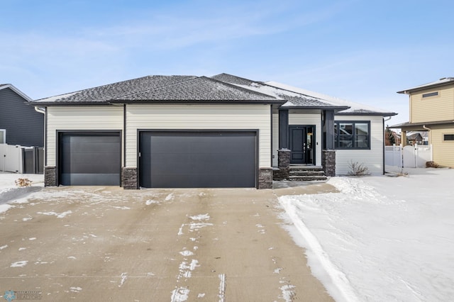 view of front of property with a garage