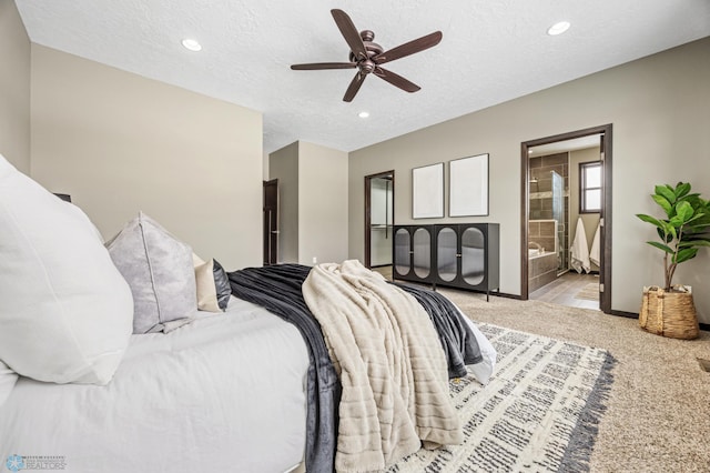 bedroom with light carpet, recessed lighting, a textured ceiling, baseboards, and ensuite bathroom
