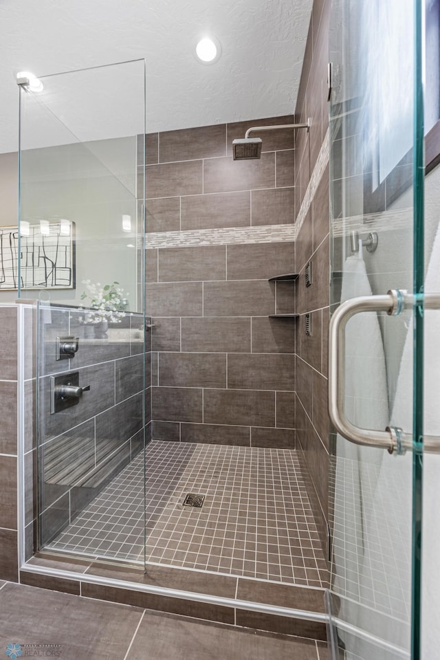 bathroom with a stall shower, recessed lighting, and tile patterned flooring
