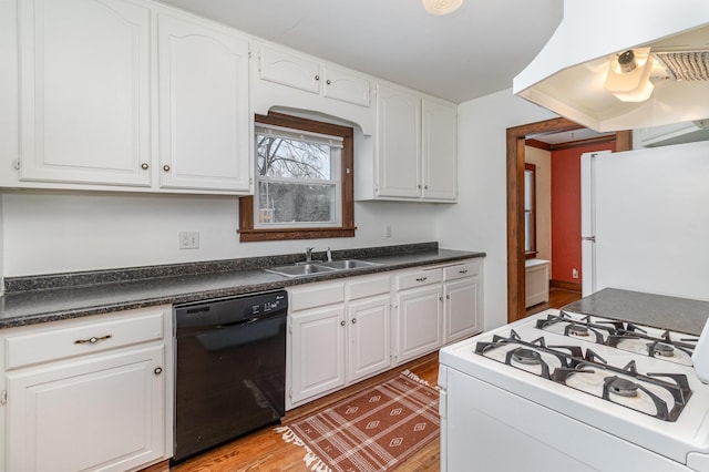 kitchen featuring sink, white cabinetry, light wood-type flooring, white appliances, and range hood