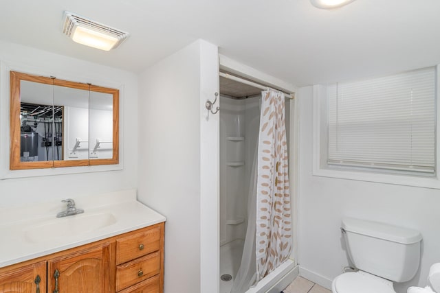 bathroom with vanity, tile patterned floors, toilet, and a shower with shower curtain