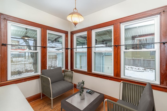 sunroom featuring a healthy amount of sunlight and radiator heating unit