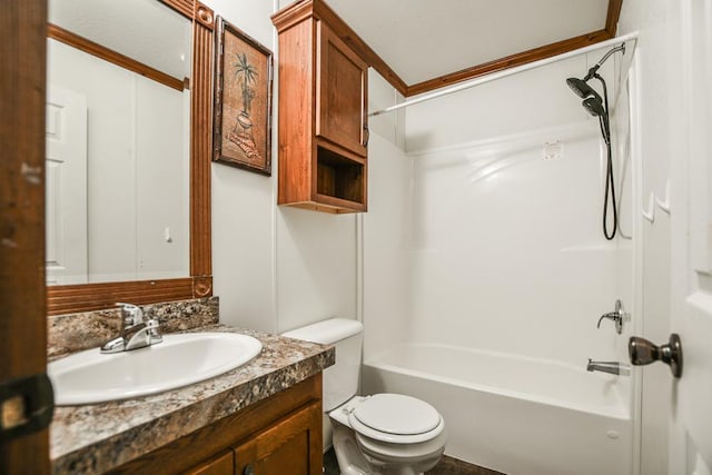 full bathroom featuring toilet, vanity, ornamental molding, and shower / washtub combination