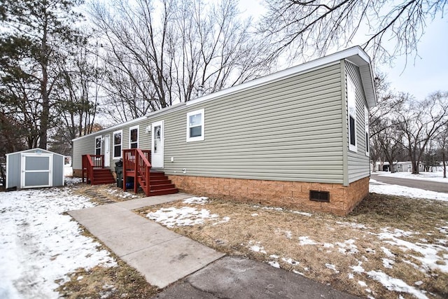 view of front of house featuring a storage unit