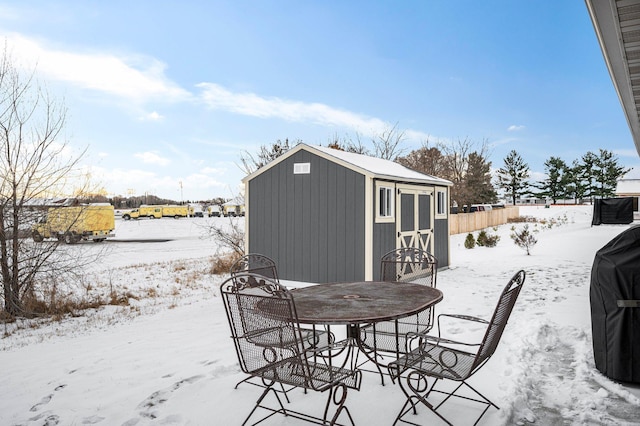 exterior space with grilling area and a shed