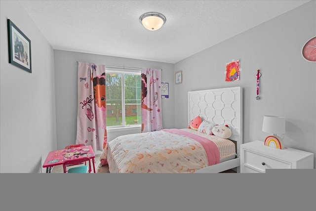 bedroom featuring a textured ceiling