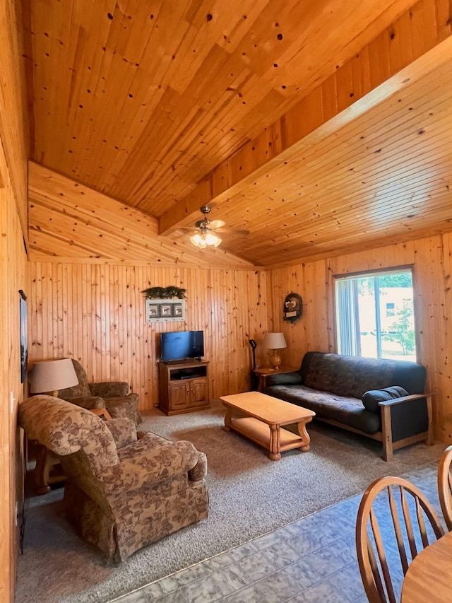 living room with carpet, wood ceiling, wood walls, ceiling fan, and beam ceiling