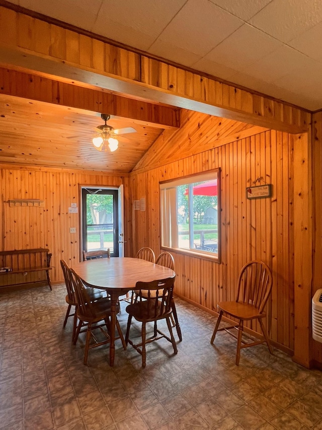 dining room with ceiling fan and beam ceiling