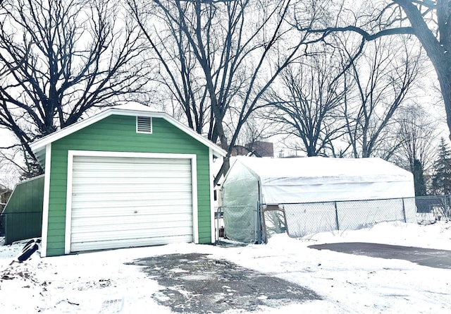 view of snow covered garage