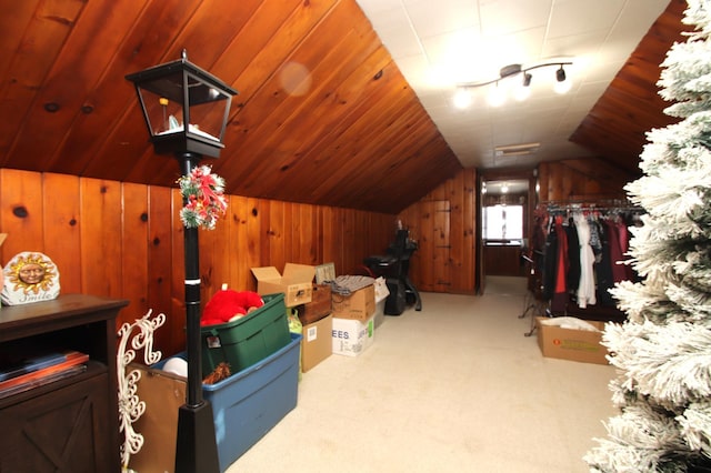 additional living space featuring light carpet, wood ceiling, vaulted ceiling, and wood walls