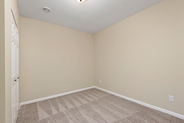 spare room featuring carpet