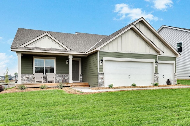 craftsman-style house featuring a porch, a garage, and a front lawn