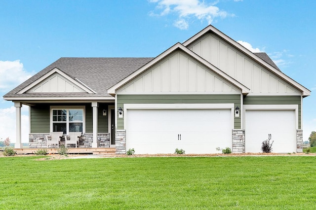 craftsman-style home with a porch, a garage, and a front yard