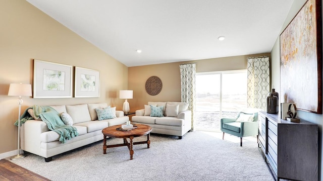 living room featuring hardwood / wood-style flooring and lofted ceiling