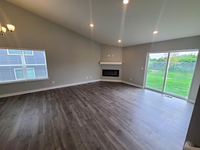 unfurnished living room with dark hardwood / wood-style flooring