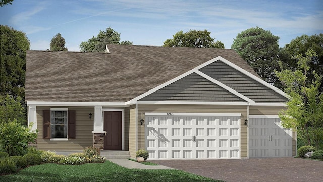 view of front facade featuring a garage and a front lawn