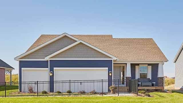 craftsman-style house featuring a garage and a front lawn