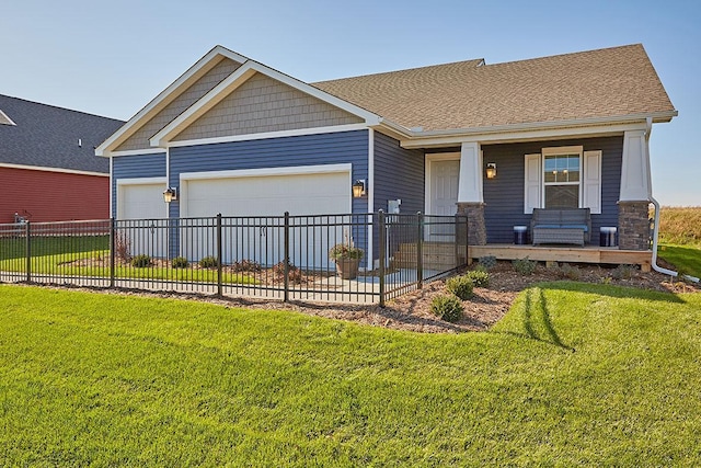 craftsman-style home with a garage and a front lawn