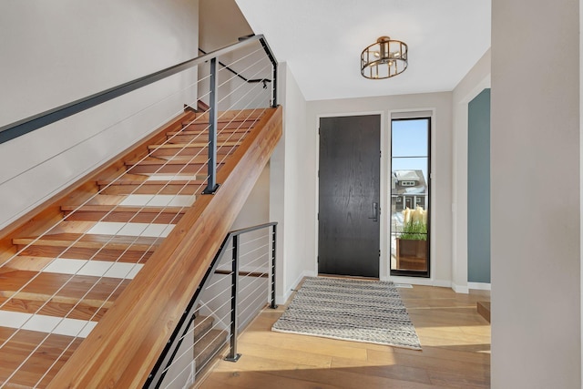 entryway featuring a chandelier and hardwood / wood-style floors