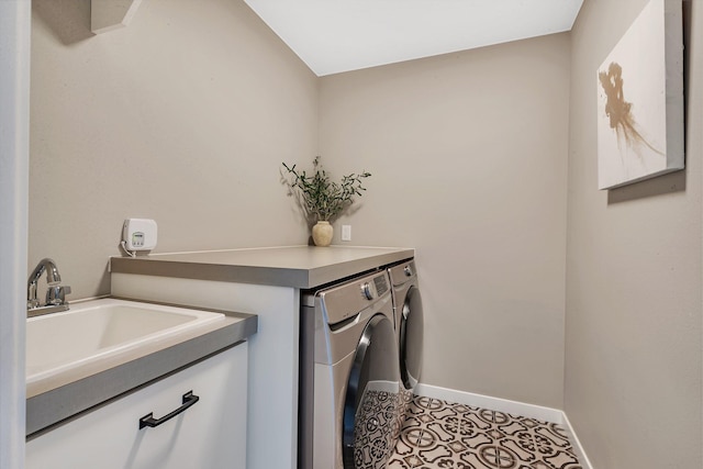 clothes washing area with separate washer and dryer, light tile patterned floors, and sink