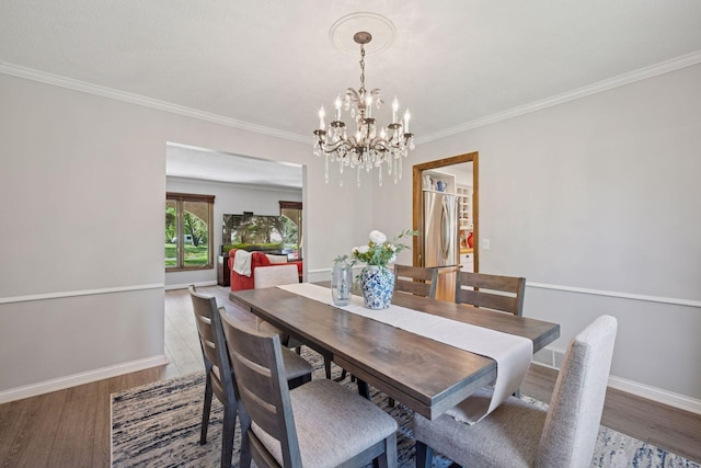 2500 Urbandale Ln N, Plymouth, MN 55447 - dining room with a chandelier, wood finished floors, and ornamental molding