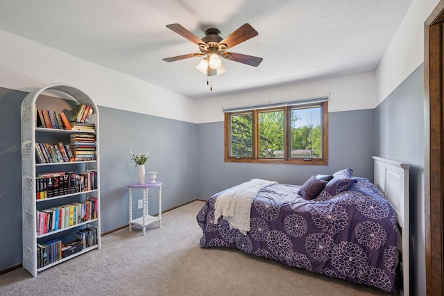 2500 Urbandale Ln N, Plymouth, MN 55447 - carpeted bedroom with a ceiling fan and a textured ceiling