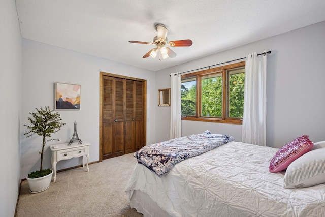 2500 Urbandale Ln N, Plymouth, MN 55447 - bedroom with carpet floors, a closet, and a ceiling fan