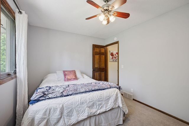2500 Urbandale Ln N, Plymouth, MN 55447 - carpeted bedroom with baseboards and a ceiling fan