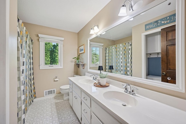 2500 Urbandale Ln N, Plymouth, MN 55447 - full bathroom featuring double vanity, healthy amount of natural light, and a shower with curtain