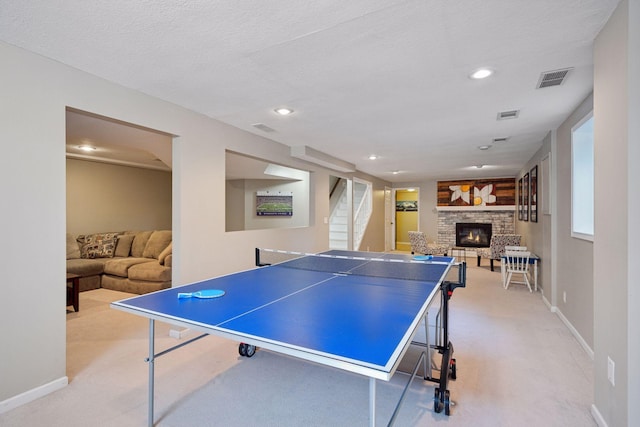 2500 Urbandale Ln N, Plymouth, MN 55447 - playroom featuring light carpet, a glass covered fireplace, and recessed lighting