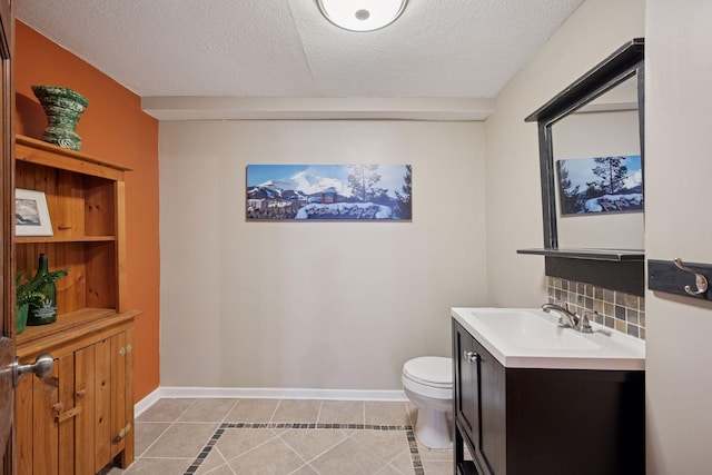 2500 Urbandale Ln N, Plymouth, MN 55447 - half bathroom with tile patterned flooring, vanity, and a textured ceiling
