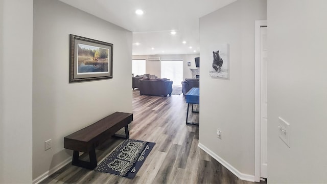 hallway with hardwood / wood-style floors