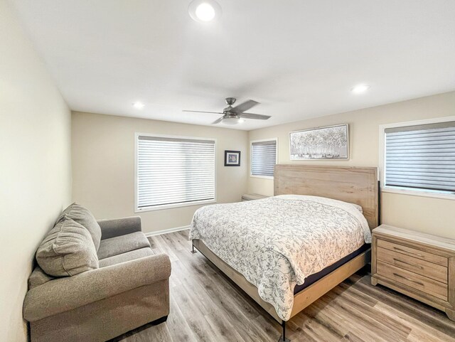 bedroom featuring hardwood / wood-style flooring and ceiling fan