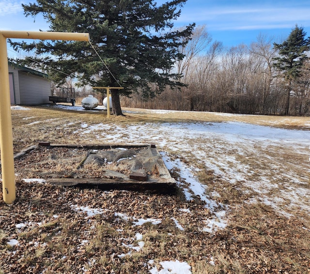 view of yard layered in snow