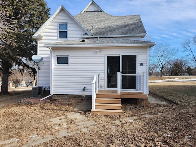 back of house featuring central AC unit