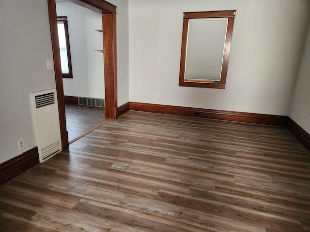 spare room with dark hardwood / wood-style floors