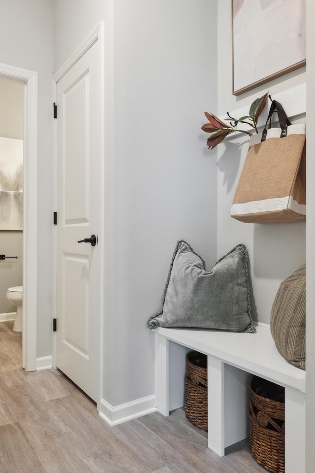 mudroom with light hardwood / wood-style flooring