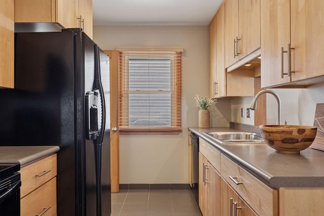 kitchen featuring black fridge with ice dispenser, baseboards, light brown cabinetry, and a sink