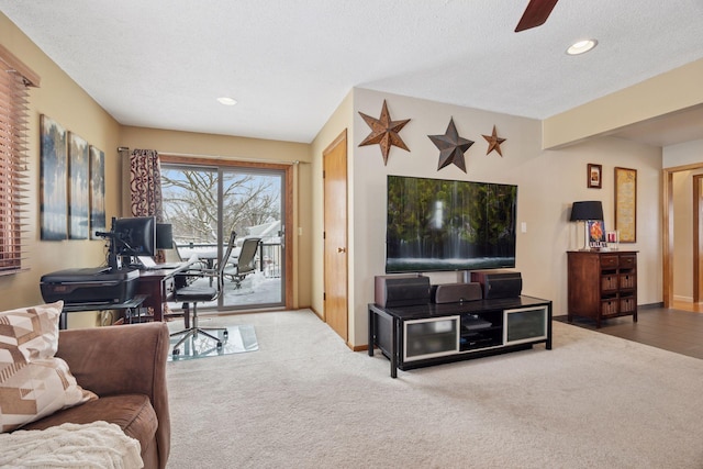 living room with recessed lighting, baseboards, carpet floors, and a textured ceiling