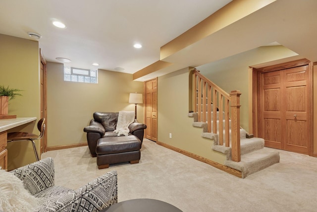 living area with light carpet, stairway, recessed lighting, and baseboards