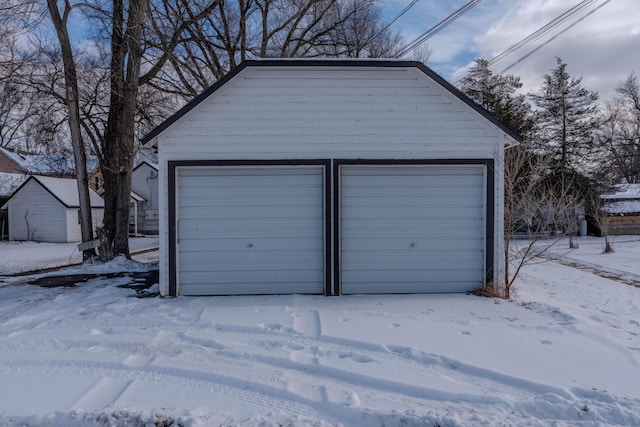 view of snow covered garage