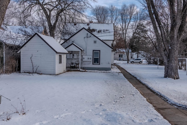 view of snow covered house