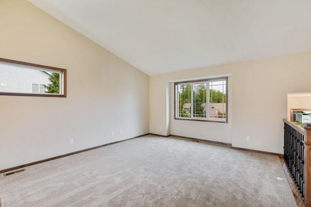 unfurnished bedroom with lofted ceiling and light colored carpet