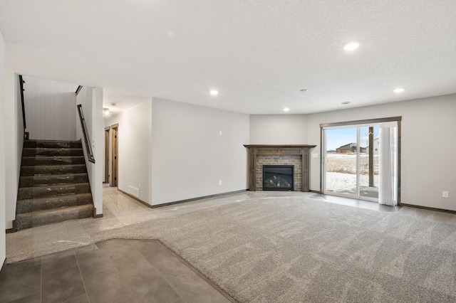 9971 14th Cir NE, Saint Michael, MN 55376 - unfurnished living room with recessed lighting, a fireplace with flush hearth, stairs, and baseboards