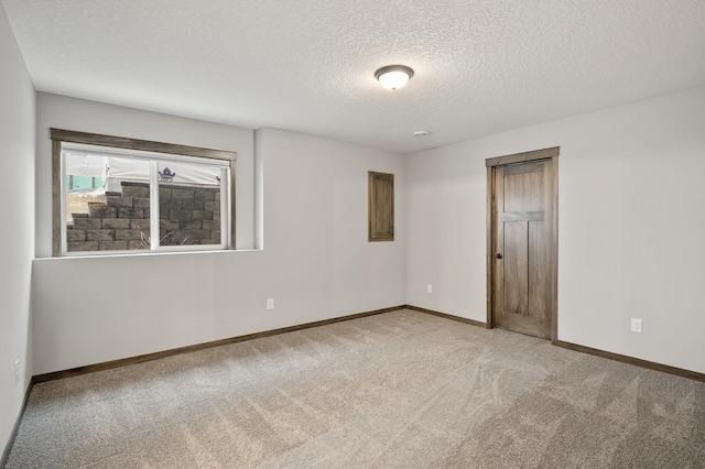 9971 14th Cir NE, Saint Michael, MN 55376 - unfurnished room featuring light carpet, baseboards, and a textured ceiling