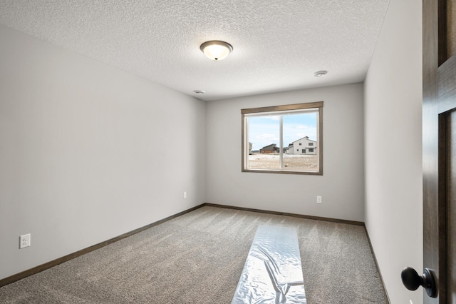 9971 14th Cir NE, Saint Michael, MN 55376 - carpeted spare room with a textured ceiling and baseboards