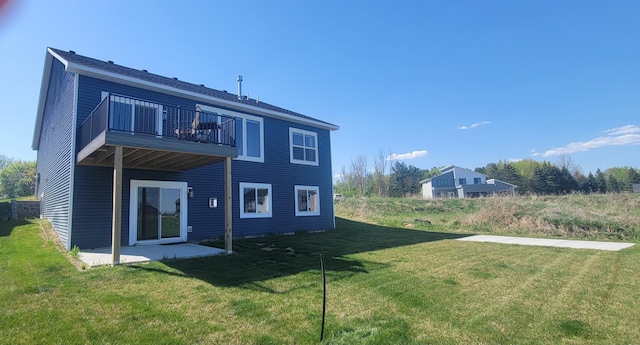 9971 14th Cir NE, Saint Michael, MN 55376 - rear view of property featuring a balcony, a yard, and a patio area